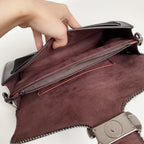 Coah bag open top with long zip pocket and maroon lining, burgundy exterior