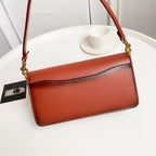 Coah crossbody bag with smooth brown front flap and gold chain strap