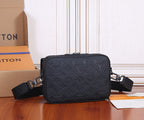 Louis Vuitton crossbody bag, dark navy monogram pattern, zipper top, adjustable straps