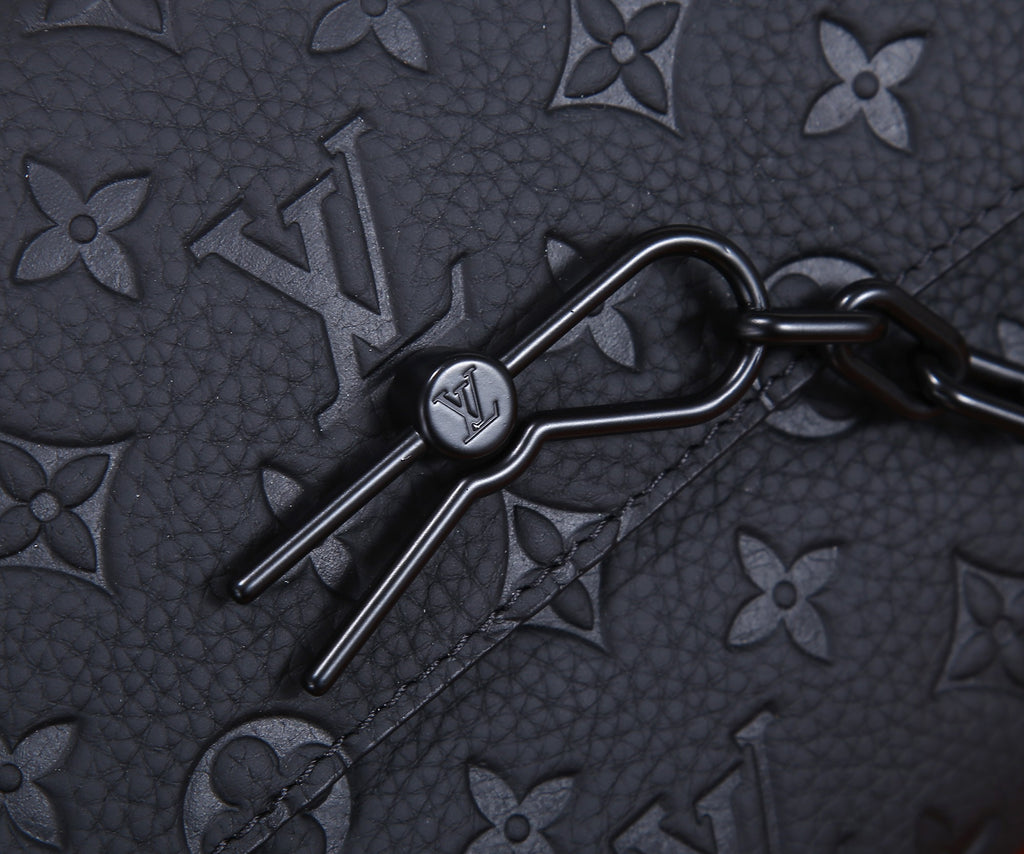 Louis Vuitton key holder clip with metal ring on dark monogram leather
