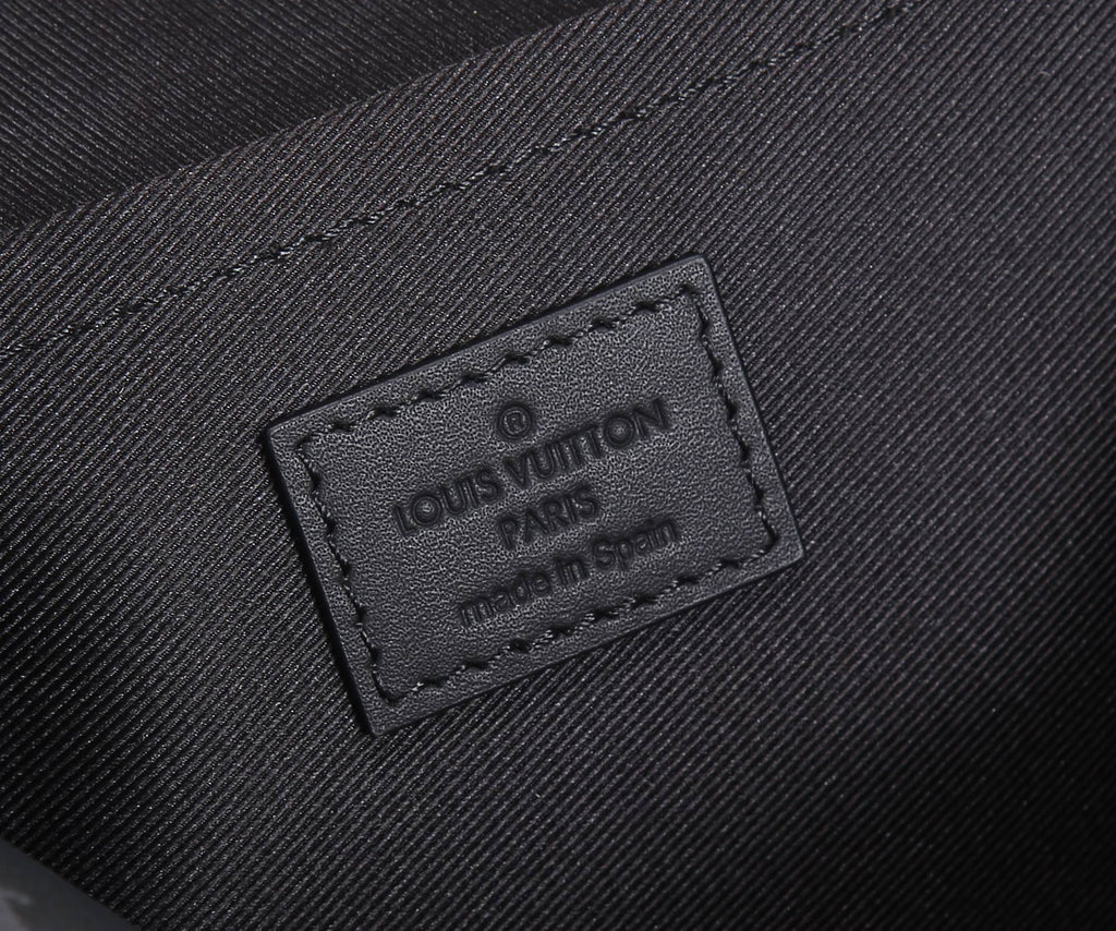 Louis Vuitton embossed fabric label on inside panel