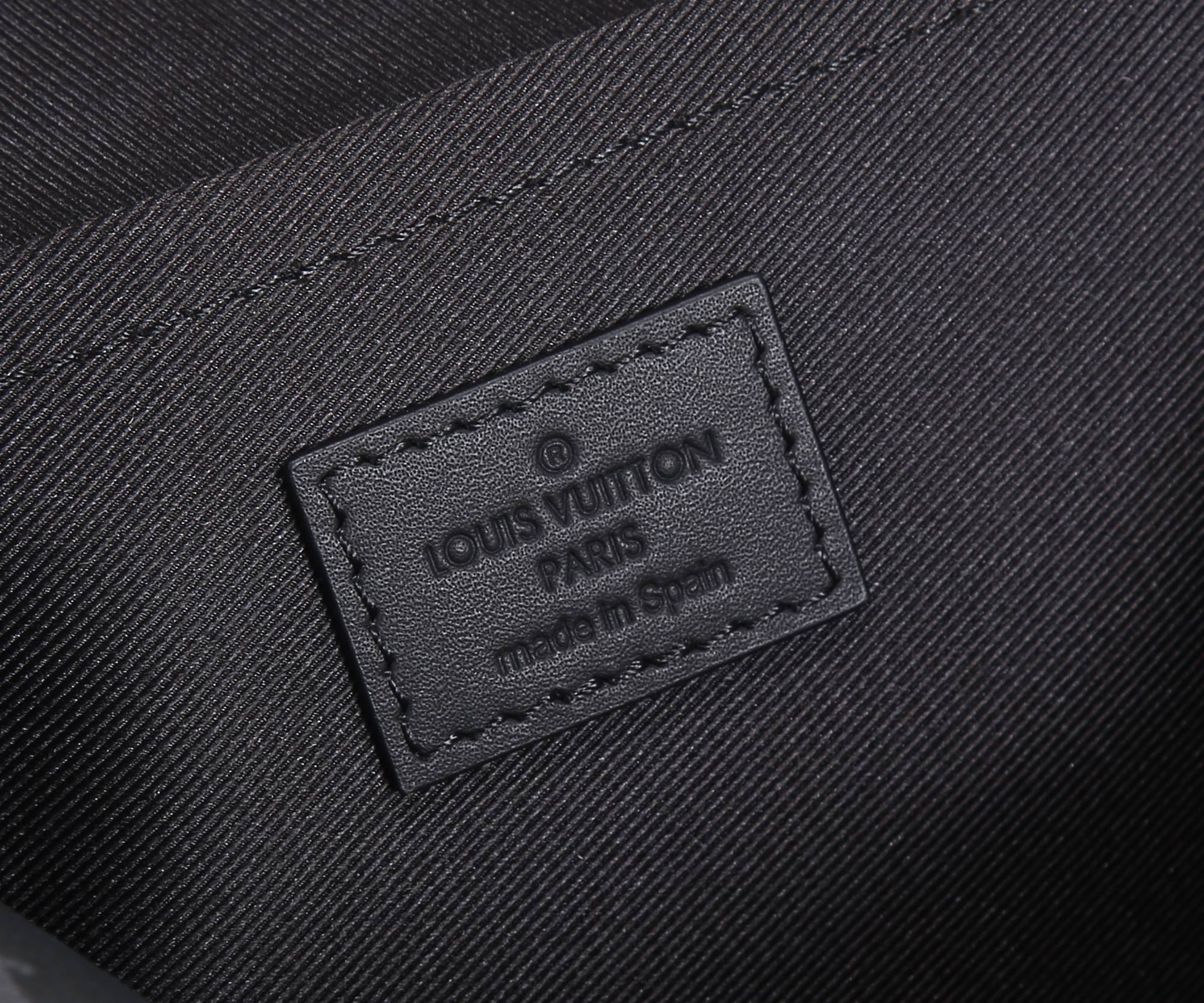 Louis Vuitton embossed fabric label on inside panel