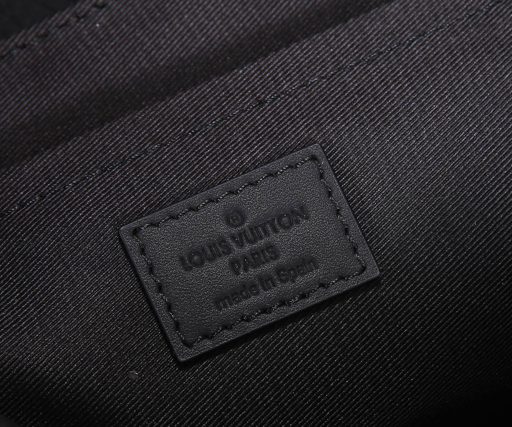 Dark monogram bag label patch with embossed text