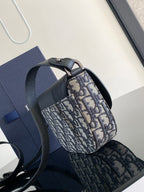 Dior mini bag with round top handle and blue-and-beige monogram canvas body