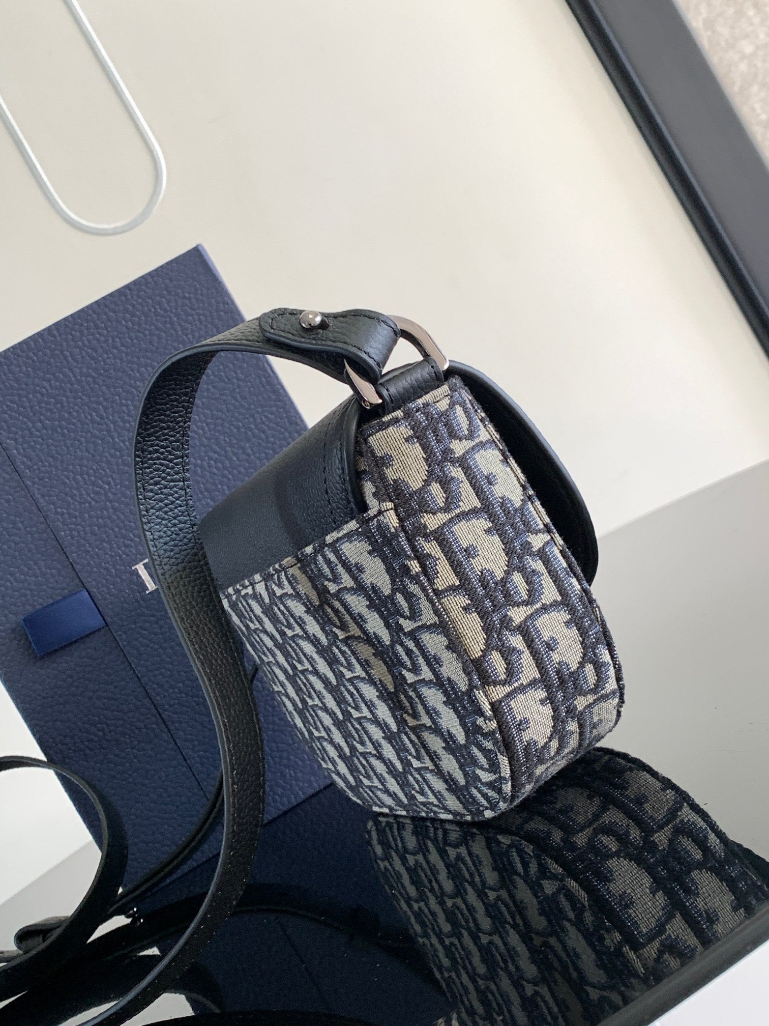 Dior mini bag with round top handle and blue-and-beige monogram canvas body