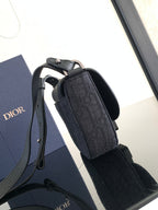 Dior compact crossbody bag, dark fabric monogram, handle and strap attachment