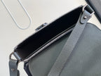 Dior gray leather bag interior view with top flap opening and side seam detail.