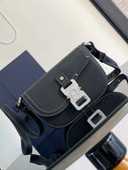 Navy leather Dior shoulder bag with front flap, snap clasp, and adjustable strap