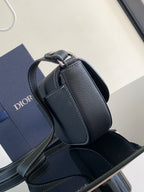 Dark leather Dior mini bag with curved flap top handle and front tab detail