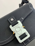 Dark leather Dior bag with silver logo plate charm and snap button closure