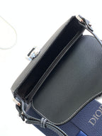 Navy leather Dior crossbody bag with open interior lining and edge stitching
