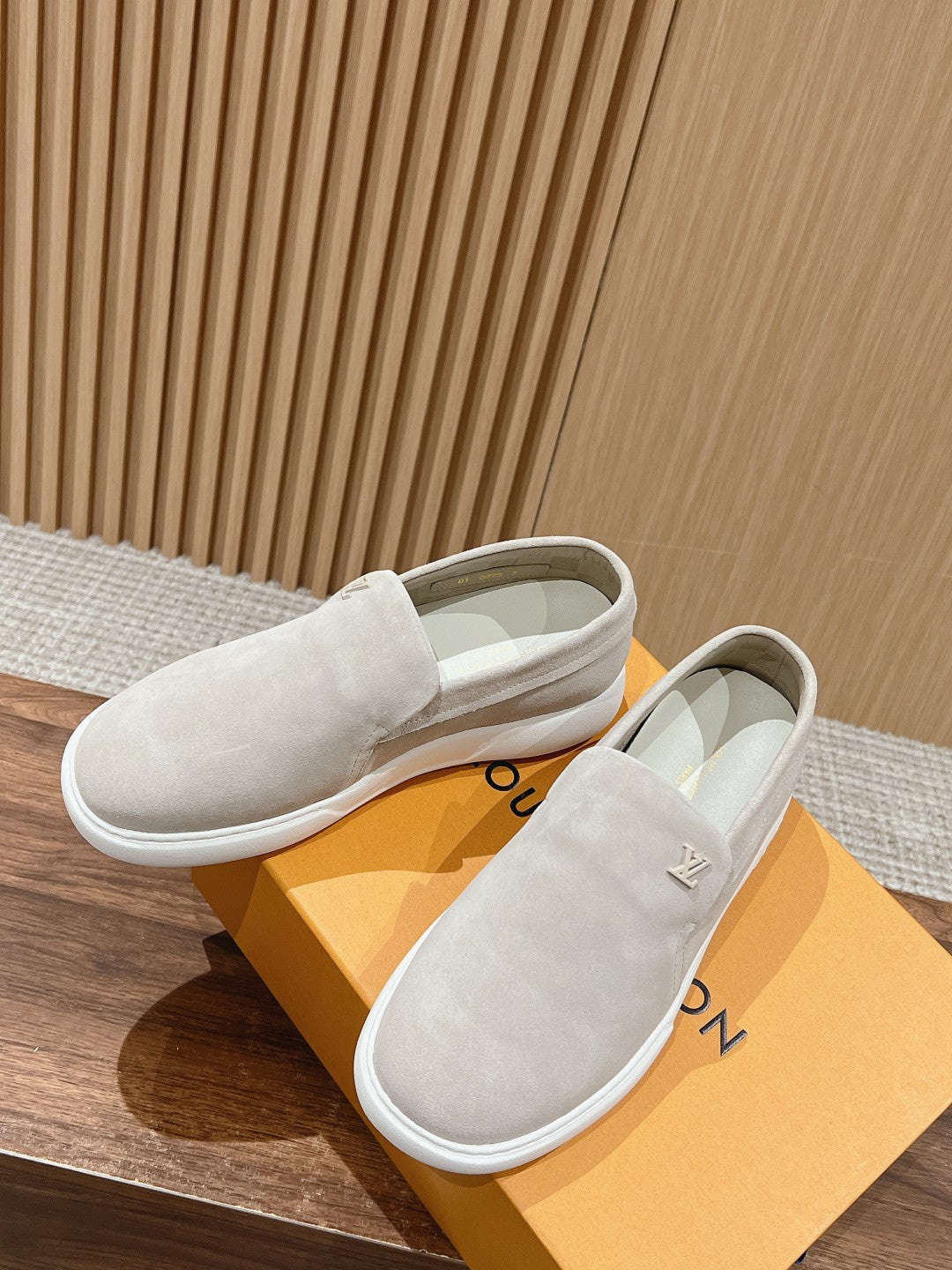 Louis Vuitton suede slip-on shoes, light beige, on box with logo detail