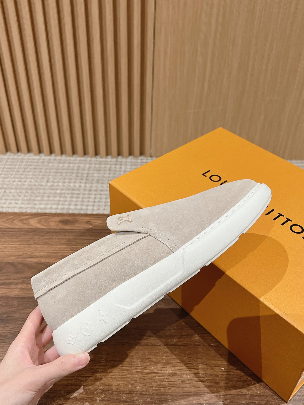 Louis Vuitton suede slip-on shoes, light beige, close-up on white sole