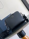 Small textured leather crossbody bag in dark blue with silver-tone hardware and D charm