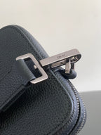 Dark blue textured leather crossbody bag strap connector with silver buckle hardware