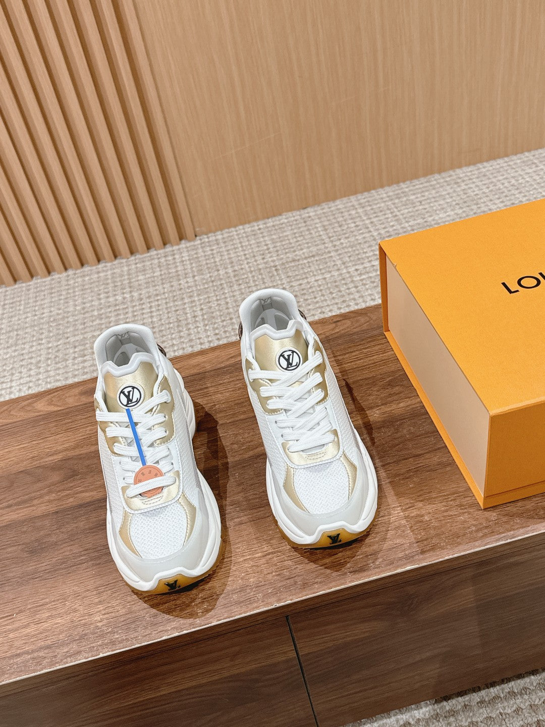 White Louis Vuitton unisex sneakers with chunky sole and lace-up front