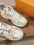 White Louis Vuitton unisex sneaker close-up, textured mesh side and lace-up