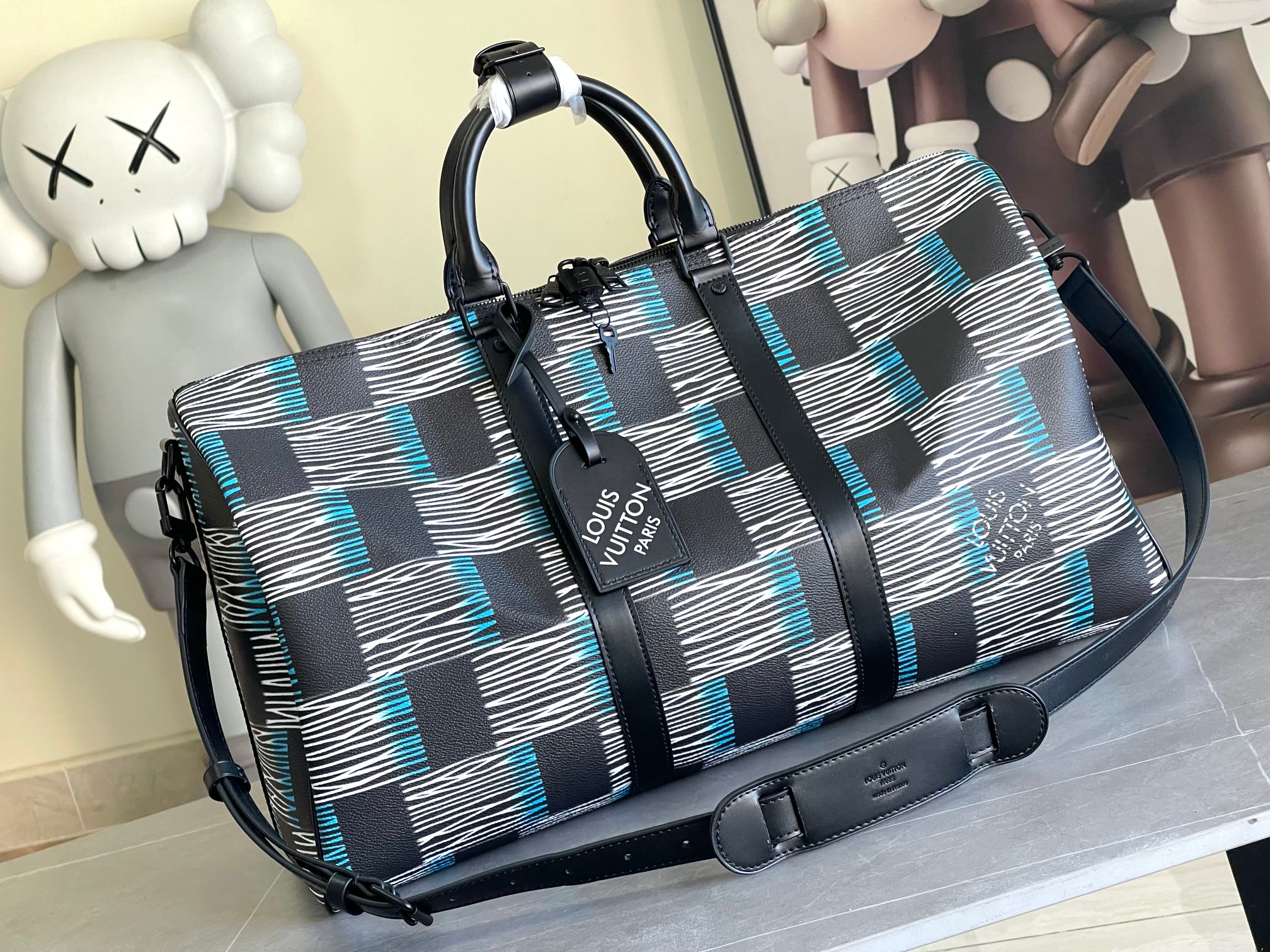 Louis Vuitton duffel bag in navy, blue and white check with top handles and strap