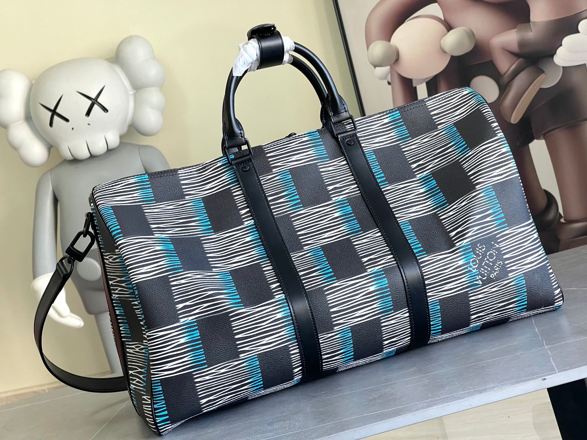 Louis Vuitton duffel bag with navy-blue and white check panels, front zipper and shoulder strap