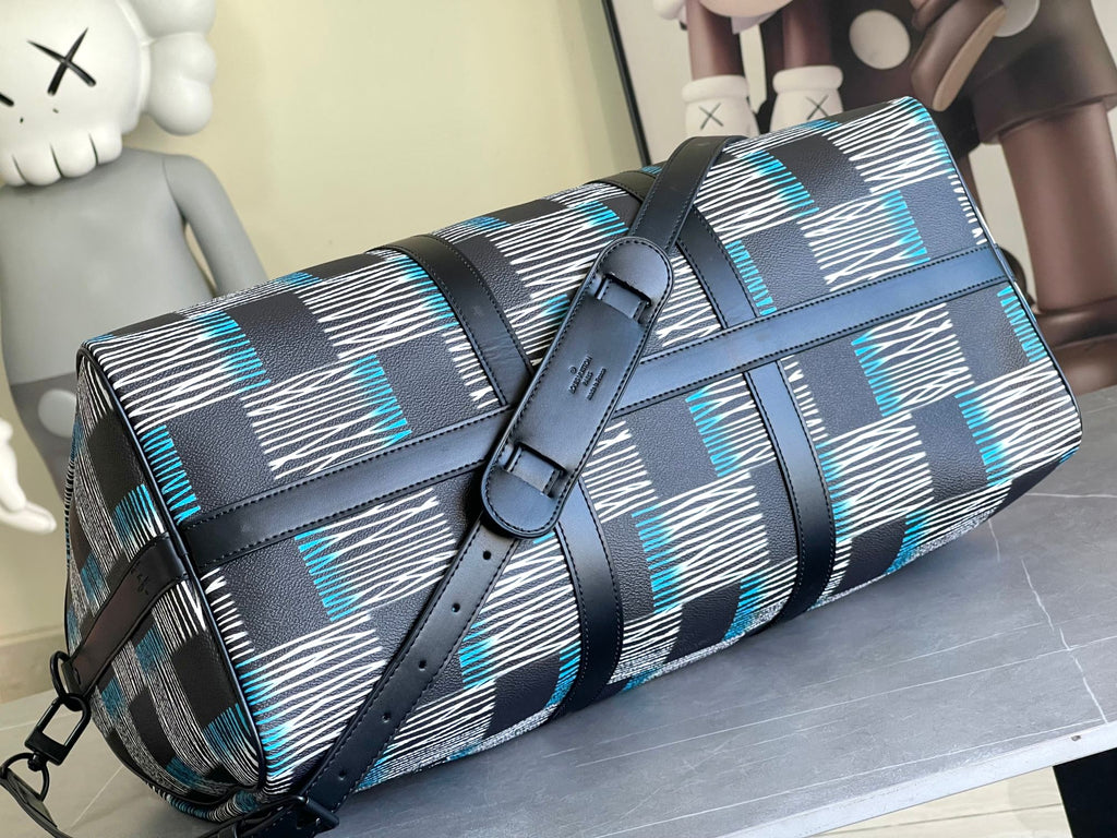 Louis Vuitton duffel bag with flap front, navy and blue check pattern, adjustable shoulder strap