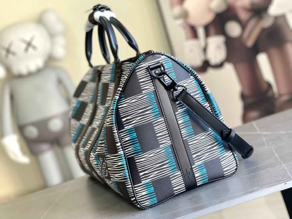 Louis Vuitton duffel bag with rounded top, navy and blue check fabric, black strap and buckle