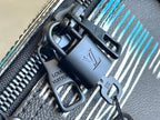 Louis Vuitton duffel bag strap hardware with metal rings and stitched trim detail