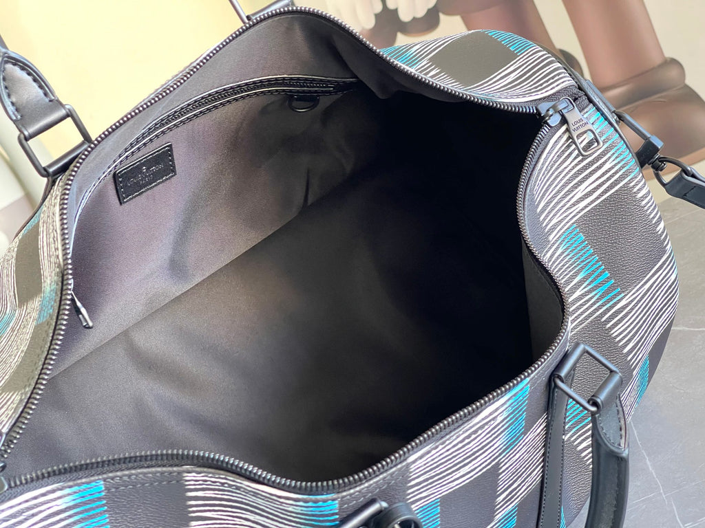 Louis Vuitton duffel bag interior view with open top and navy, blue and white check trim