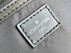 Louis Vuitton duffel bag leather logo patch with Louis Vuitton Paris text on textured panel