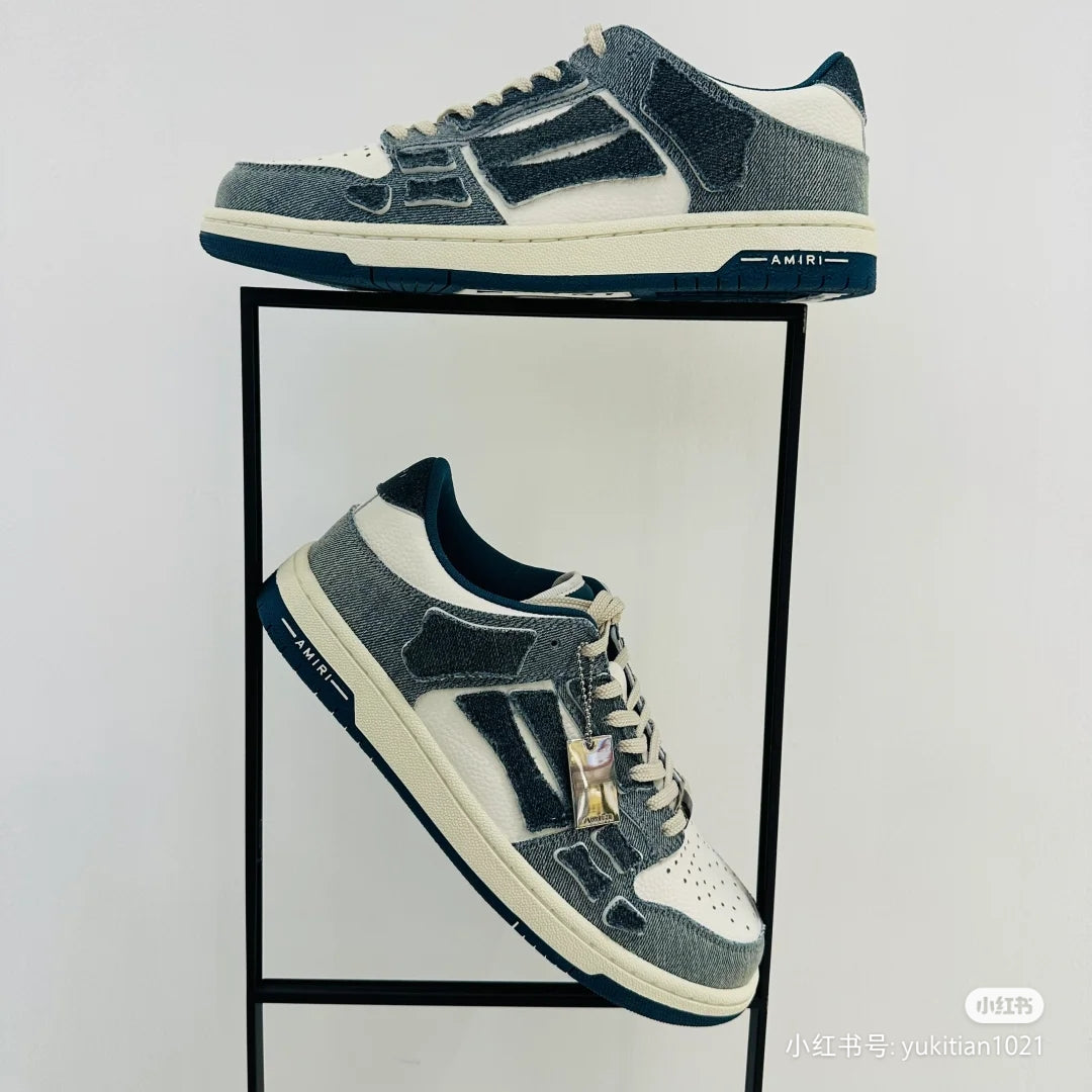 Amiri low-top sneakers, side view, dark blue and white with lace-up and logo patch