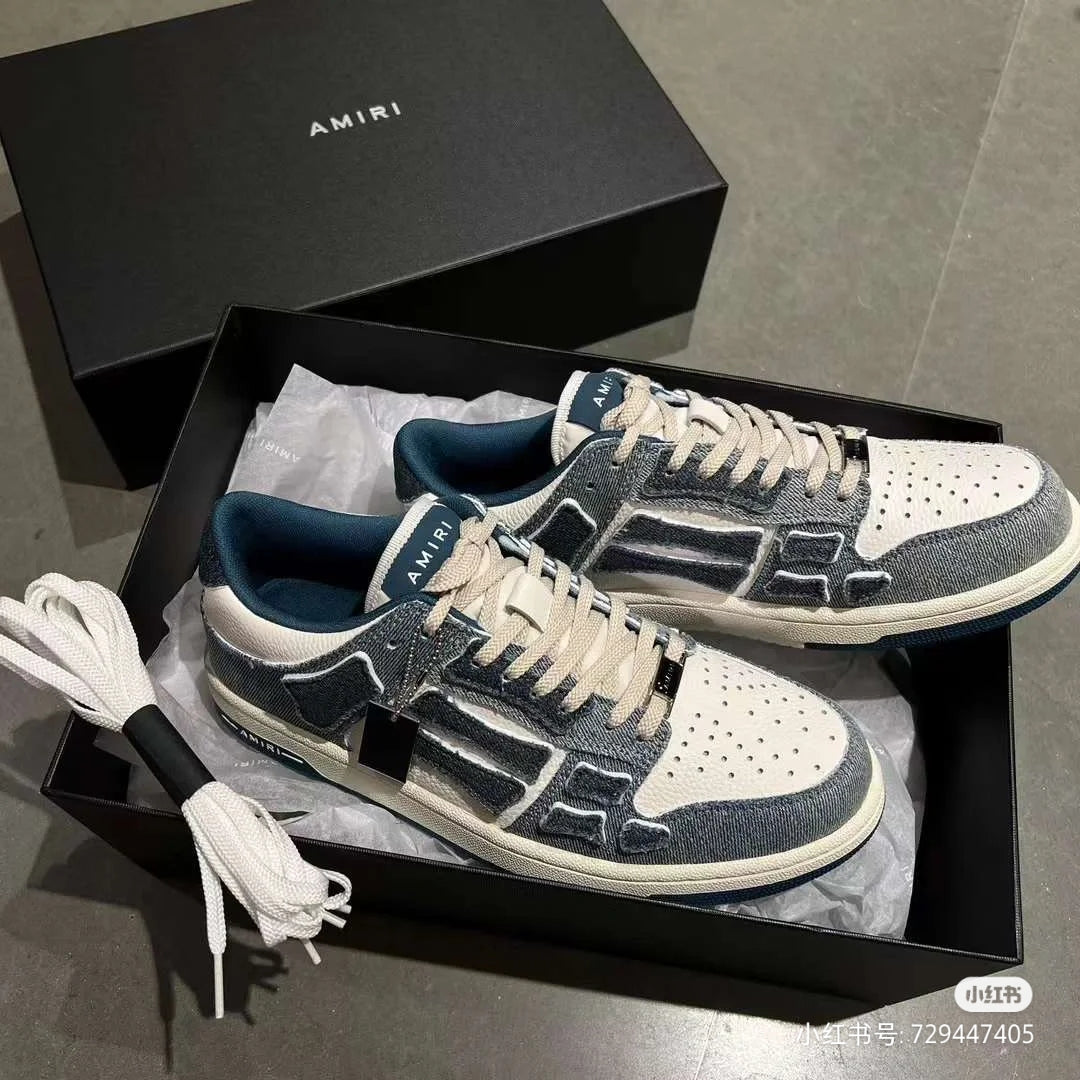 Amiri low-top sneakers in box, gray and white leather with blue logo stripe
