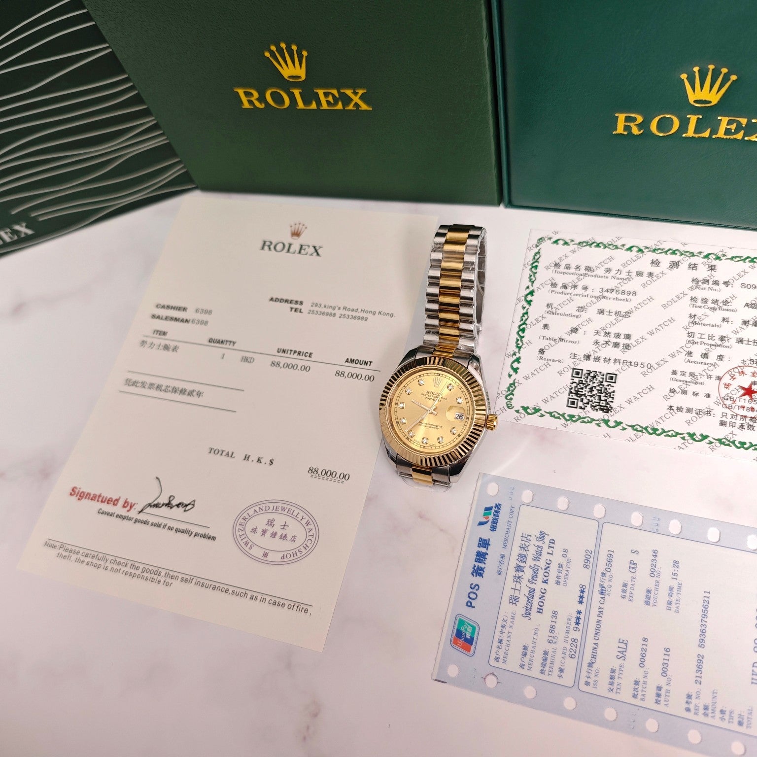 Rolex Day-Date watch with gold dial on paperwork and certificate in green presentation box