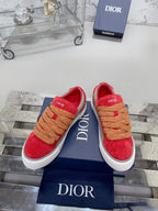 Red suede sneakers, tan rope laces, white sole, Dior logo on side