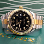 Rolex two-tone stainless steel and gold wristwatch with black dial and diamond markers