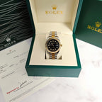 Rolex two-tone wristwatch in display box, black dial with gold bezel