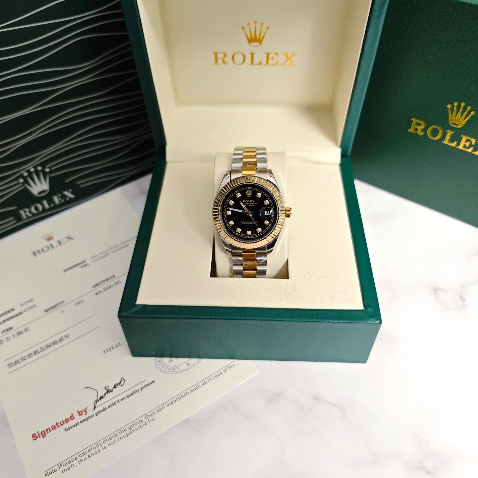 Rolex two-tone wristwatch in display box, black dial with gold bezel