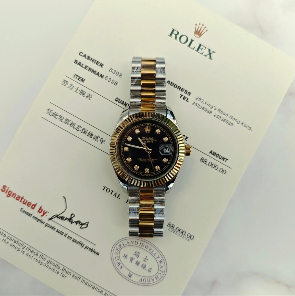 Rolex two-tone wristwatch on paperwork, black dial with gold hour markers and hands