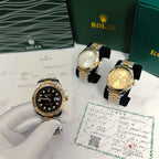 Rolex two-tone wristwatches on display with black dial and gold accents