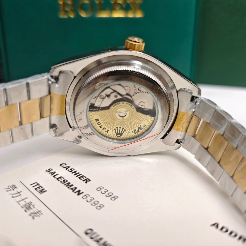 Rolex two-tone wristwatch caseback with gold crown on steel bracelet