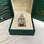 Rolex two-tone wristwatch with silver dial and gold/steel link bracelet in a box