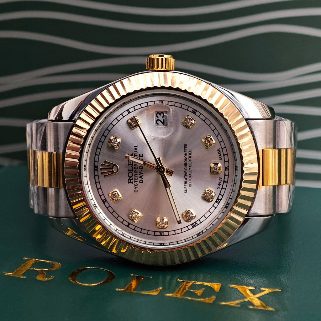 Rolex two-tone watch with gold bezel, silver dial, and metal link bracelet