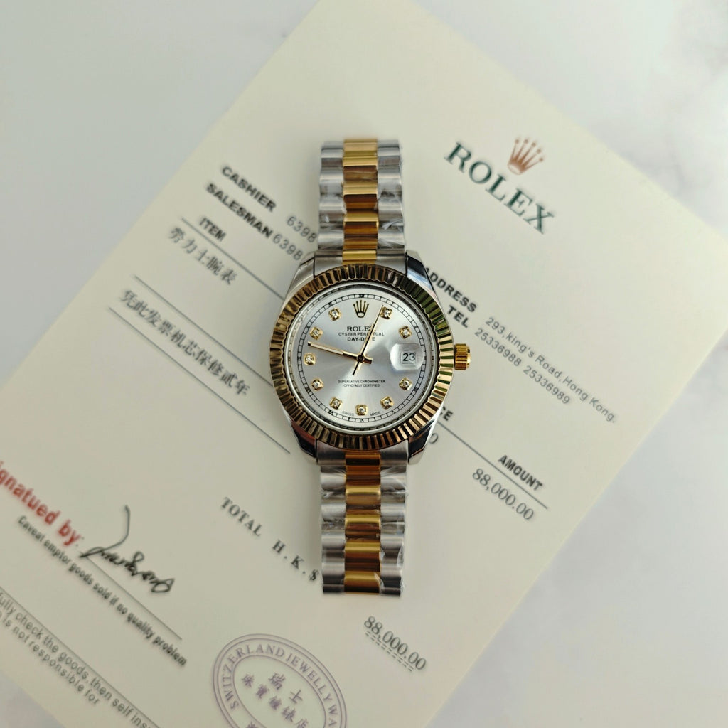Rolex two-tone watch close-up with silver dial, gold accents, and diamond bezel