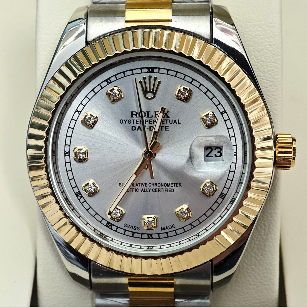 Rolex two-tone dial close-up with gold markers, date window, and gold/steel bezel