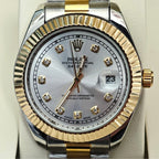 Rolex two-tone dial close-up with gold markers, date window, and gold/steel bezel