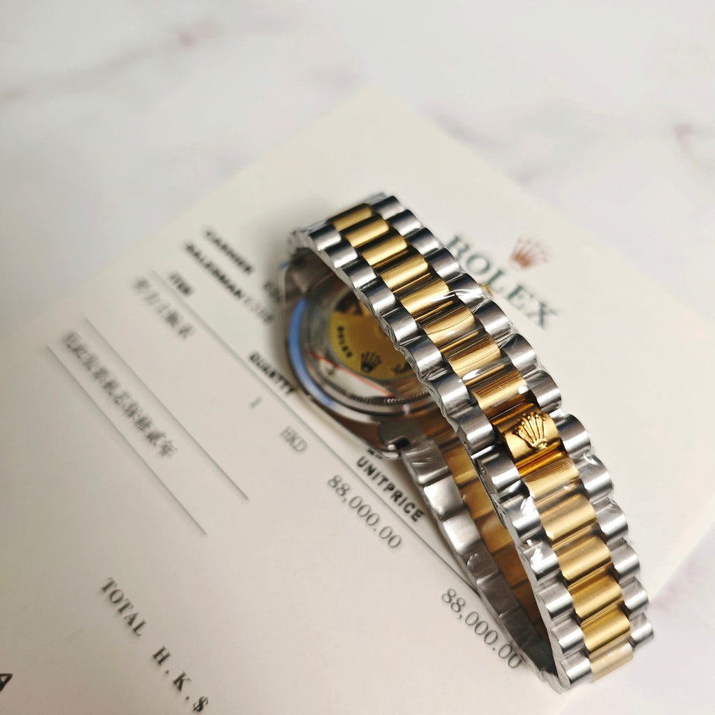 Rolex two-tone bracelet and case side view with gold and steel metal links