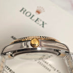 Rolex watch crown and bezel close-up on a clear caseback