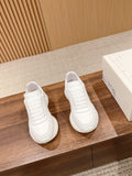 Alexander McQueen white sneakers, pair with lace-up front and ribbed panel details