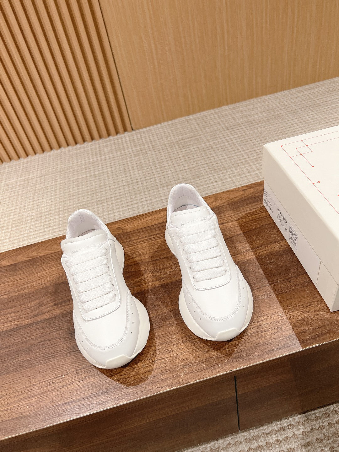 Alexander McQueen white sneakers, pair with lace-up front and ribbed panel details