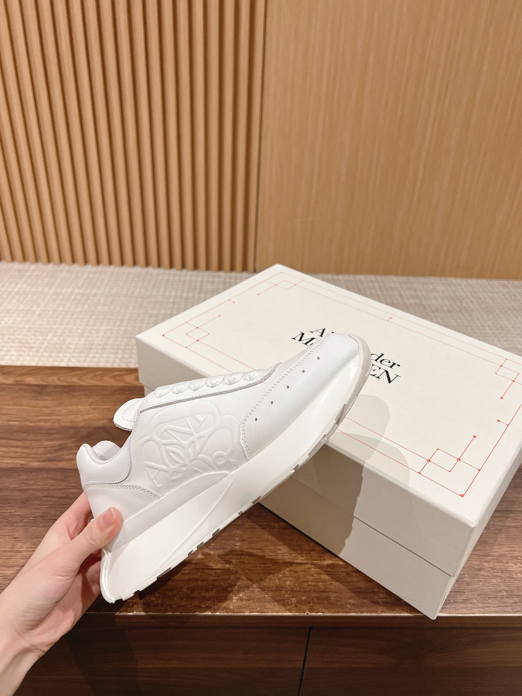 Alexander McQueen white sneakers, lace-up with embossed floral logo on side