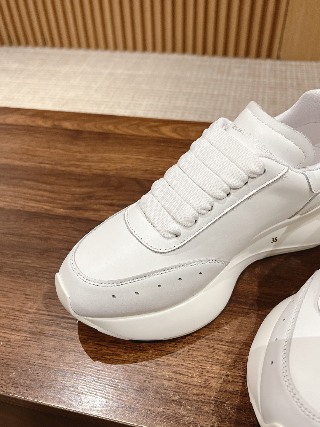 Alexander McQueen white sneakers, lace-up with perforated toe and padded collar