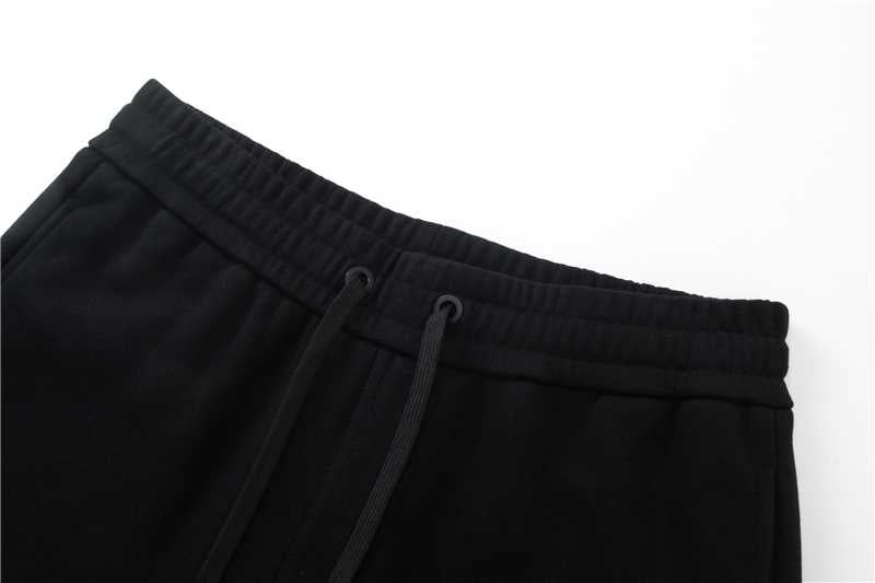Black jogger pants waistband with drawstring and elastic seam